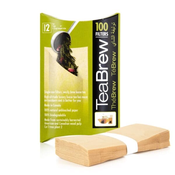 A package of tea brew is shown next to two wooden blocks.