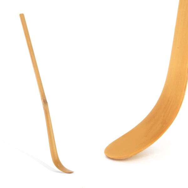 A wooden stick and a hockey stick on a white background