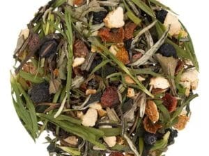 A bowl of tea with nuts and green leaves.