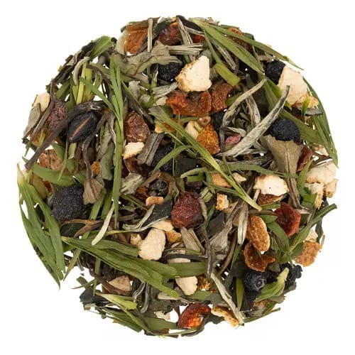 A bowl of tea with nuts and green leaves.