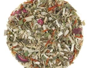 A pile of dried herbs and spices on top of a white surface.