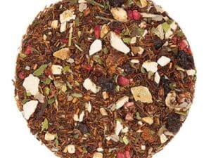 A round plate of tea with fruit and nuts.