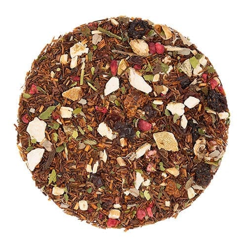 A round plate of tea with fruit and nuts.